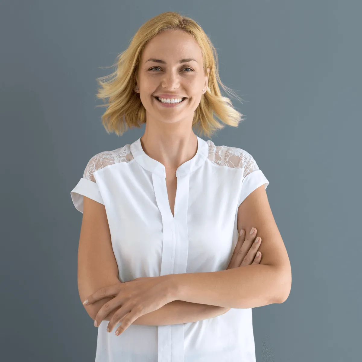 Woman smiling with her arms crossed